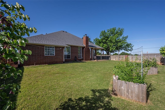 3001 NE 129th St, Edmond, OK 73013 - back of house with a chimney, brick siding, and a shingled roof