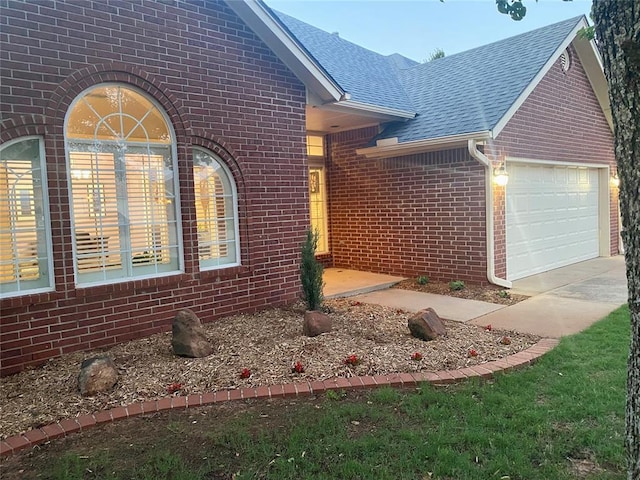3001 NE 129th St, Edmond, OK 73013 - ranch-style house with brick siding, an attached garage, a shingled roof, and concrete driveway