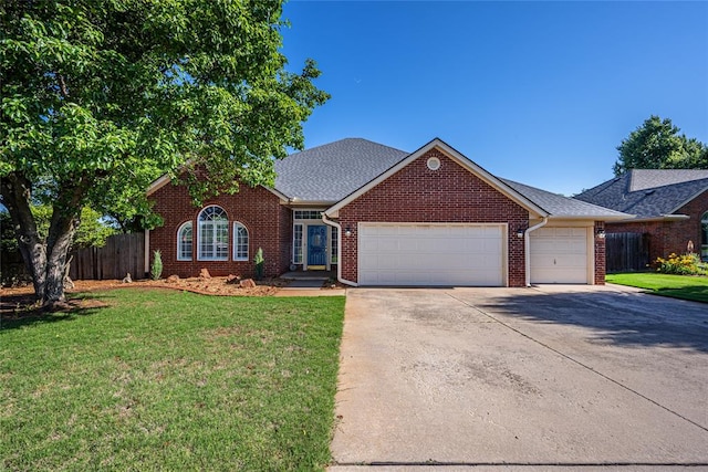 3001 NE 129th St, Edmond, OK 73013 - traditional-style house featuring a garage, brick siding, and concrete driveway