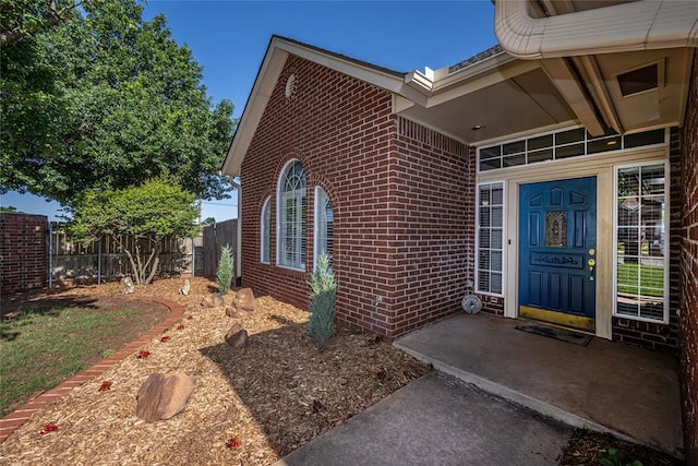3001 NE 129th St, Edmond, OK 73013 - view of exterior entry featuring brick siding