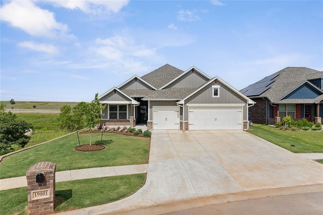 craftsman-style house with board and batten siding, an attached garage, driveway, a front lawn, and roof with shingles