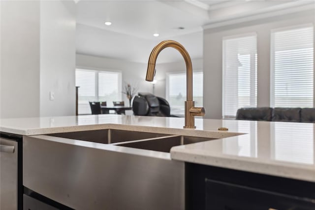 kitchen with open floor plan, light stone counters, and recessed lighting