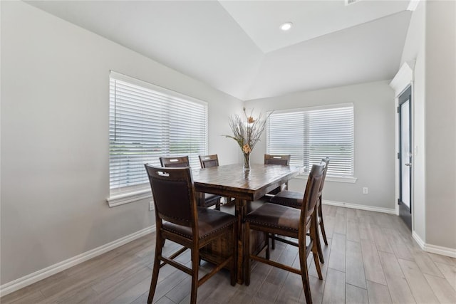 dining room featuring plenty of natural light, light wood finished floors, baseboards, and recessed lighting