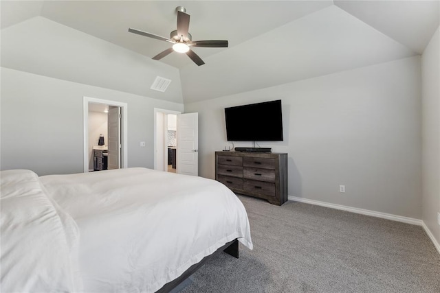 carpeted bedroom with vaulted ceiling, baseboards, ceiling fan, and ensuite bath