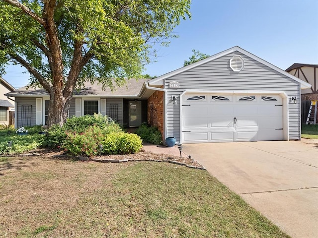 2113 Castle Rock, Edmond, OK 73003 - ranch-style home featuring an attached garage, driveway, and a front lawn