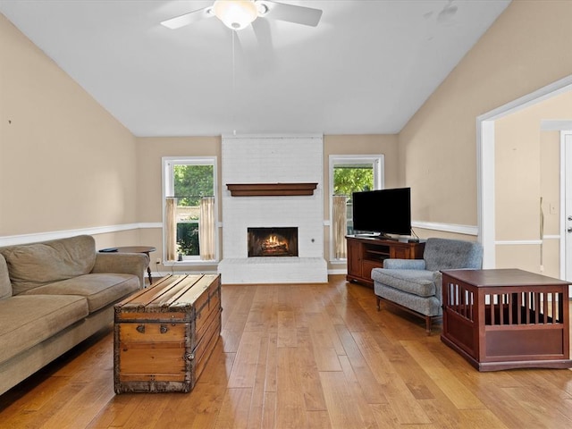 2113 Castle Rock, Edmond, OK 73003 - living area with light wood-style flooring, lofted ceiling, plenty of natural light, and ceiling fan