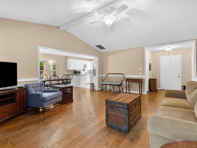 2113 Castle Rock, Edmond, OK 73003 - living area with ceiling fan and light wood-style flooring