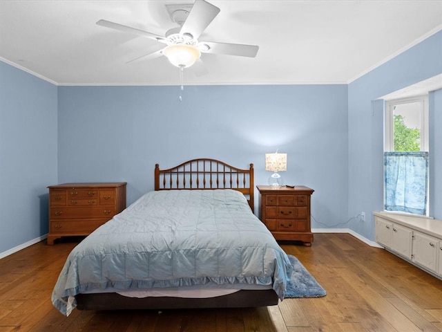 2113 Castle Rock, Edmond, OK 73003 - bedroom with crown molding, hardwood / wood-style flooring, baseboards, and ceiling fan