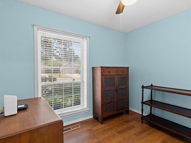 2113 Castle Rock, Edmond, OK 73003 - office area with baseboards, wood finished floors, and ceiling fan