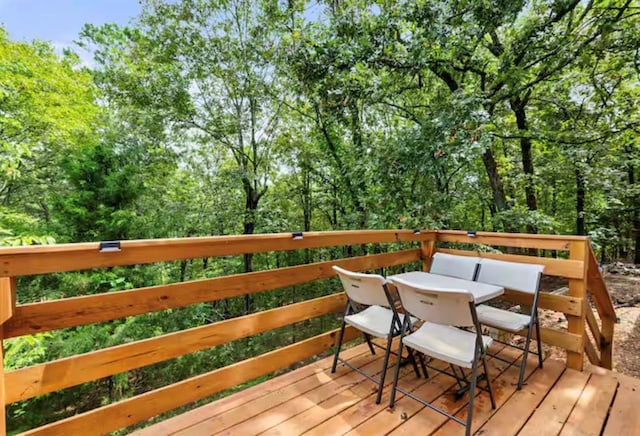 168 Bobber Rd, Broken Bow, OK 74728 - wooden deck with outdoor dining space
