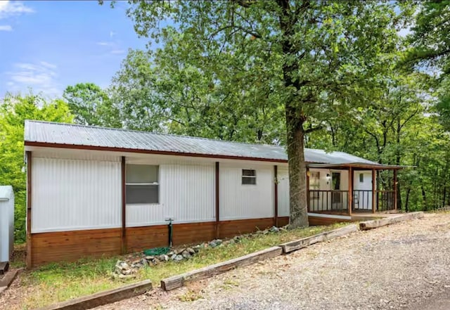 168 Bobber Rd, Broken Bow, OK 74728 - view of front facade with metal roof