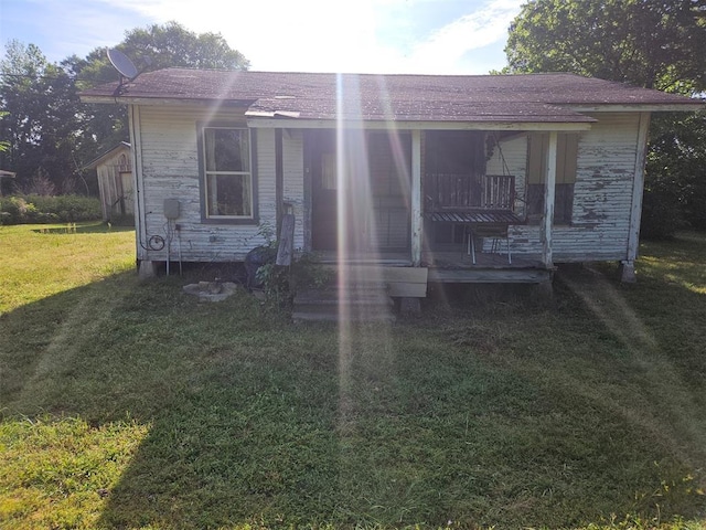 720 Mudline Rd, Eagletown, OK 74734 - view of front of home with a front lawn and a shingled roof
