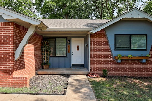 1316 W Logan Ave, Guthrie, OK 73044 - property entrance featuring brick siding and a shingled roof