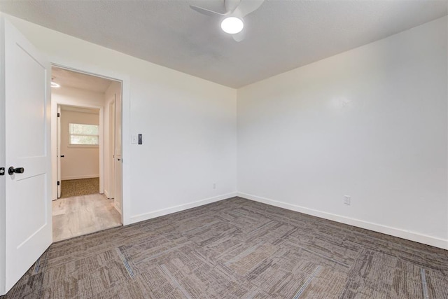 1316 W Logan Ave, Guthrie, OK 73044 - carpeted empty room with ceiling fan and baseboards