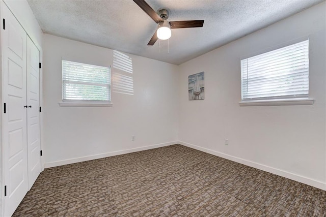 1316 W Logan Ave, Guthrie, OK 73044 - spare room with ceiling fan, carpet floors, a textured ceiling, and baseboards