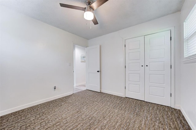 1316 W Logan Ave, Guthrie, OK 73044 - unfurnished bedroom with carpet flooring, a closet, baseboards, and ceiling fan