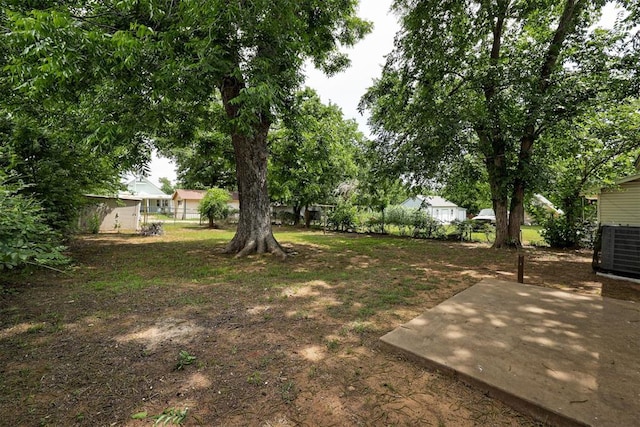 1316 W Logan Ave, Guthrie, OK 73044 - view of yard featuring a patio area and central air condition unit