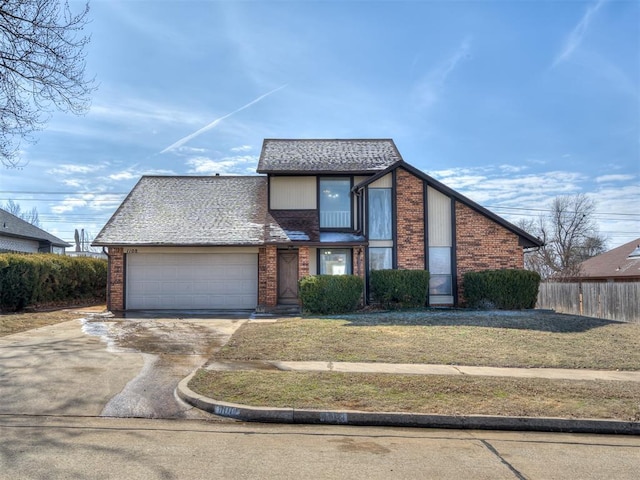 1108 SW 118th Pl, Oklahoma City, OK 73170 - view of front facade featuring concrete driveway, an attached garage, and brick siding