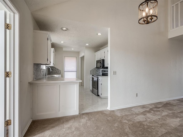 1108 SW 118th Pl, Oklahoma City, OK 73170 - kitchen with stainless steel range with electric cooktop, black microwave, tasteful backsplash, light carpet, and a textured ceiling