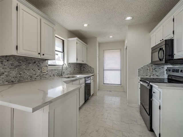 1108 SW 118th Pl, Oklahoma City, OK 73170 - kitchen featuring black appliances, a sink, white cabinetry, light marble finish floors, and a textured ceiling