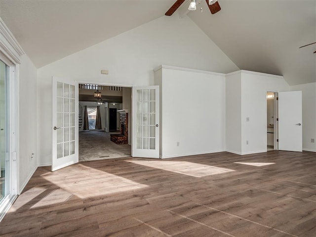 1108 SW 118th Pl, Oklahoma City, OK 73170 - unfurnished room featuring french doors, a ceiling fan, high vaulted ceiling, baseboards, and wood finished floors