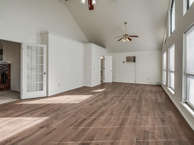 1108 SW 118th Pl, Oklahoma City, OK 73170 - unfurnished living room featuring ceiling fan, high vaulted ceiling, an AC wall unit, wood finished floors, and a brick fireplace