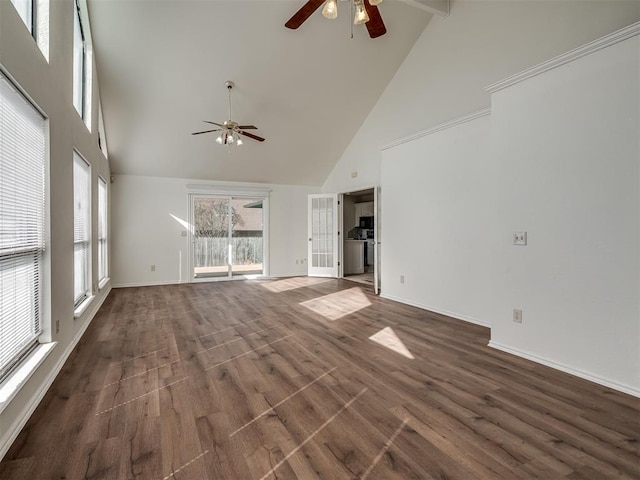 1108 SW 118th Pl, Oklahoma City, OK 73170 - unfurnished living room featuring a ceiling fan, high vaulted ceiling, wood finished floors, and baseboards