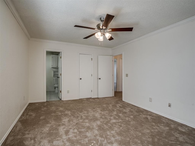 1108 SW 118th Pl, Oklahoma City, OK 73170 - unfurnished bedroom featuring ornamental molding, carpet floors, a textured ceiling, connected bathroom, and baseboards