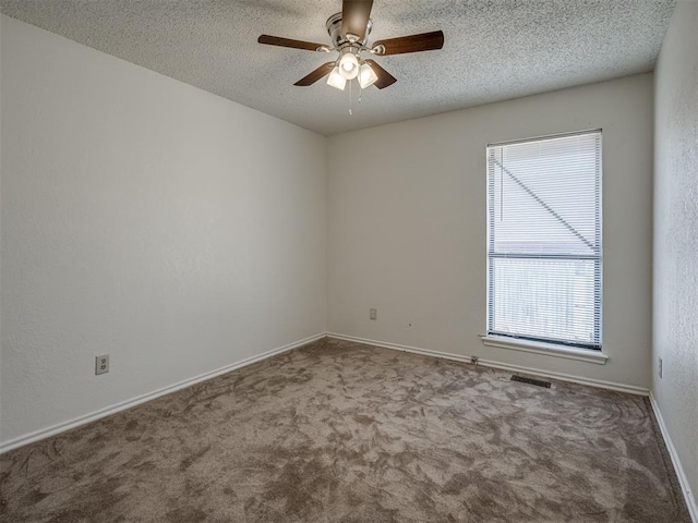 1108 SW 118th Pl, Oklahoma City, OK 73170 - spare room featuring carpet floors, a ceiling fan, a textured ceiling, and baseboards