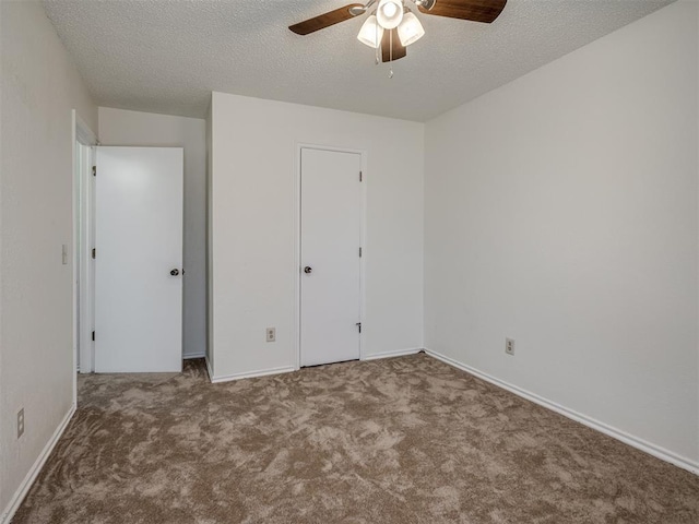 1108 SW 118th Pl, Oklahoma City, OK 73170 - unfurnished bedroom with carpet flooring, a textured ceiling, baseboards, and a ceiling fan