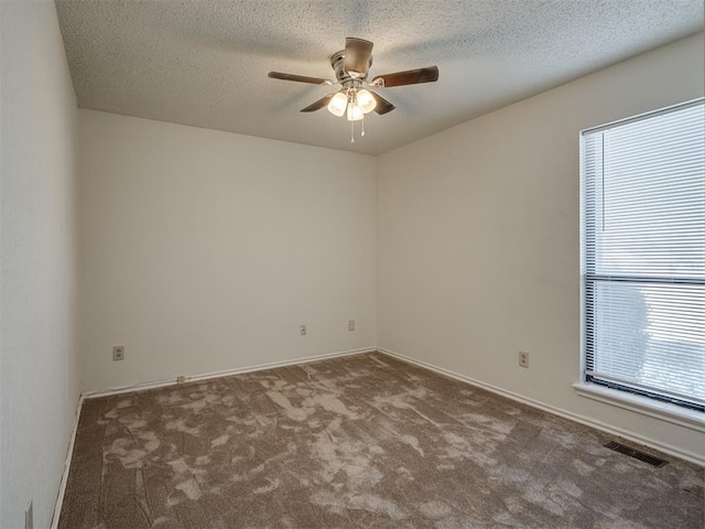 1108 SW 118th Pl, Oklahoma City, OK 73170 - carpeted spare room with ceiling fan, a textured ceiling, and baseboards