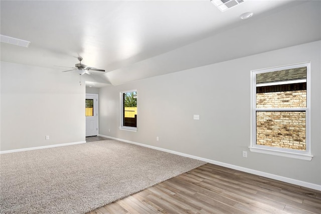 12700 Torretta Way, Yukon, OK 73099 - unfurnished room with baseboards, ceiling fan, and light wood finished floors