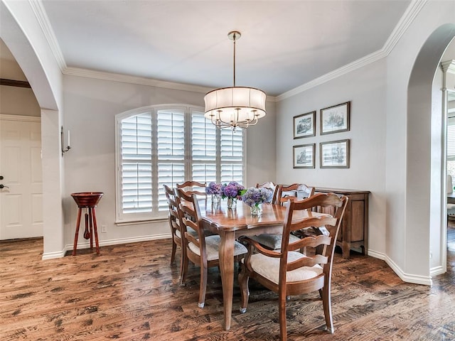 7612 NW 134th St, Oklahoma City, OK 73142 - dining room featuring arched walkways, wood finished floors, ornamental molding, baseboards, and a chandelier