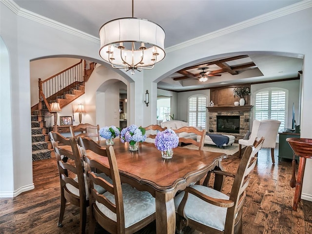 7612 NW 134th St, Oklahoma City, OK 73142 - dining room with a ceiling fan, dark wood-type flooring, ornamental molding, arched walkways, and stairway