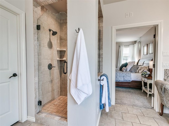 7612 NW 134th St, Oklahoma City, OK 73142 - bathroom with connected bathroom, a stall shower, tile patterned flooring, and baseboards