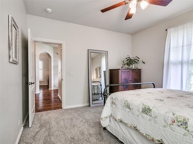 7612 NW 134th St, Oklahoma City, OK 73142 - carpeted bedroom featuring arched walkways, baseboards, and ceiling fan