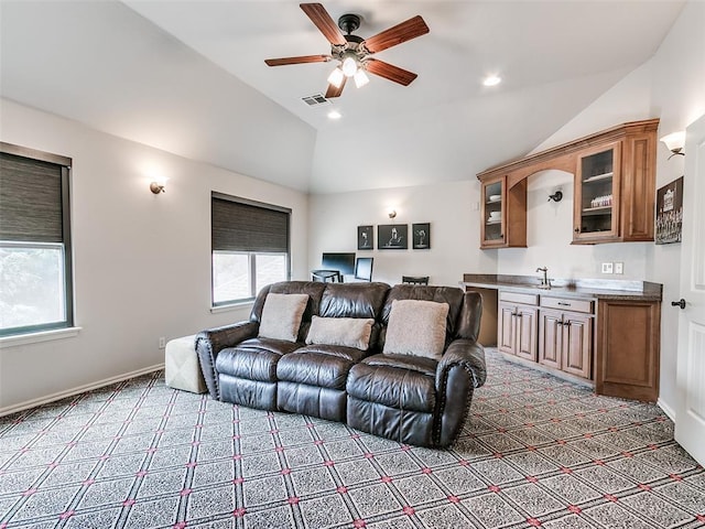 7612 NW 134th St, Oklahoma City, OK 73142 - home theater featuring light carpet, lofted ceiling, healthy amount of natural light, and a ceiling fan