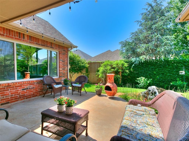 7612 NW 134th St, Oklahoma City, OK 73142 - view of patio featuring an outdoor living space