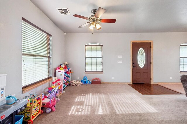 3234 N Hiwassee Rd, Choctaw, OK 73020 - playroom featuring carpet, a ceiling fan, plenty of natural light, and baseboards