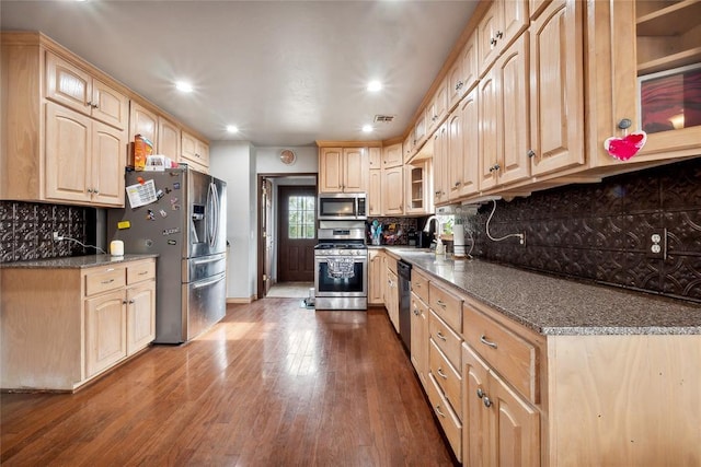 3234 N Hiwassee Rd, Choctaw, OK 73020 - kitchen with stainless steel appliances, light brown cabinets, glass insert cabinets, and recessed lighting