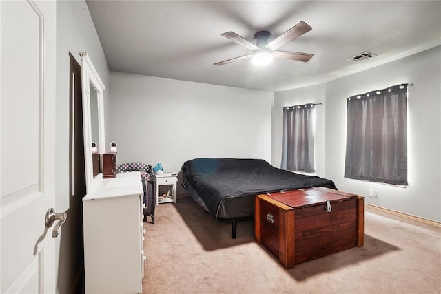 3234 N Hiwassee Rd, Choctaw, OK 73020 - bedroom with light carpet and a ceiling fan