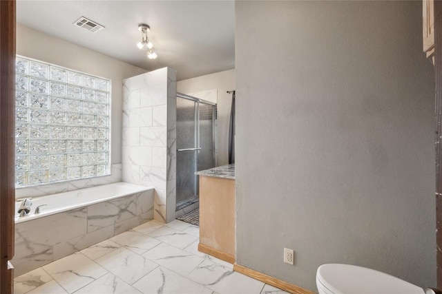 3234 N Hiwassee Rd, Choctaw, OK 73020 - bathroom with a shower stall, toilet, marble finish flooring, and a bath