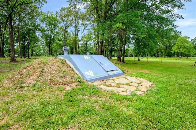 2590 Old 21 Rd, Idabel, OK 74745 - view of storm shelter featuring a lawn and view of scattered trees