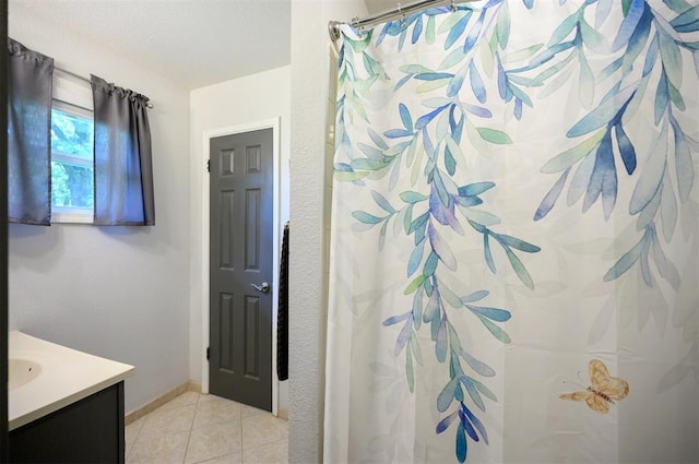 2590 Old 21 Rd, Idabel, OK 74745 - bathroom featuring vanity, tile patterned flooring, a shower with curtain, and baseboards