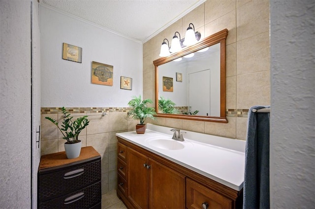 2590 Old 21 Rd, Idabel, OK 74745 - bathroom with tile walls, ornamental molding, a textured ceiling, and vanity