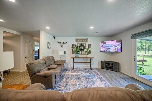 2590 Old 21 Rd, Idabel, OK 74745 - living area featuring wood finished floors, recessed lighting, and baseboards