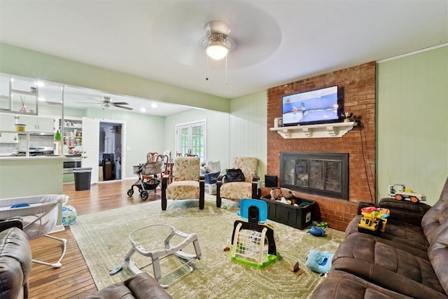 3217 NW 34th St, Oklahoma City, OK 73112 - living area featuring ceiling fan, wood finished floors, and a fireplace