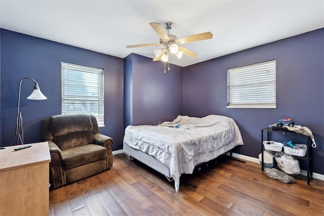 3217 NW 34th St, Oklahoma City, OK 73112 - bedroom featuring wood-type flooring, baseboards, and a ceiling fan