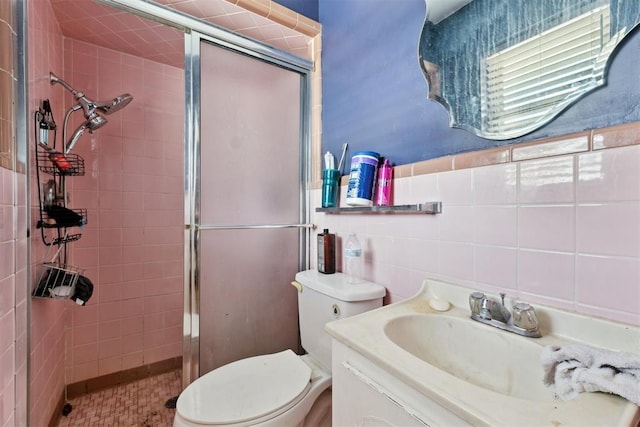 3217 NW 34th St, Oklahoma City, OK 73112 - bathroom with a shower stall, vanity, toilet, and tile walls