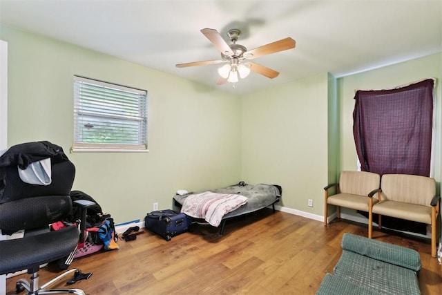 3217 NW 34th St, Oklahoma City, OK 73112 - bedroom with wood finished floors, ceiling fan, and baseboards
